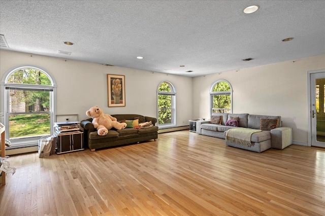 4 Pine Glen Dr, Blauvelt, NY 10913 - living area featuring a textured ceiling, recessed lighting, light wood-style flooring, and visible vents
