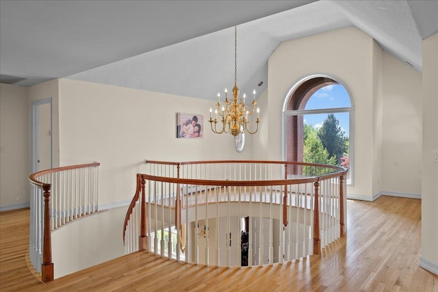 4 Pine Glen Dr, Blauvelt, NY 10913 - stairway with baseboards, vaulted ceiling, wood finished floors, and an inviting chandelier