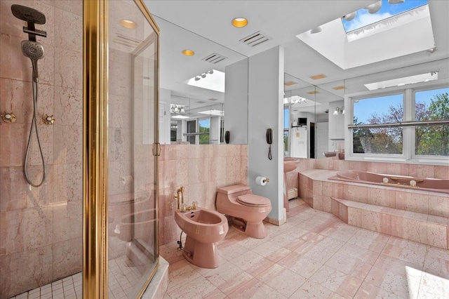 4 Pine Glen Dr, Blauvelt, NY 10913 - bathroom featuring a garden tub, a bidet, a skylight, a shower stall, and toilet