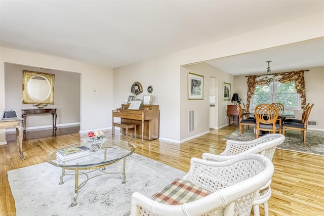 8 Ferndale Rd, New City, NY 10956 - living area featuring wood finished floors, baseboards, and a chandelier