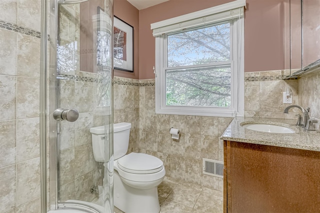 8 Ferndale Rd, New City, NY 10956 - full bathroom with tile walls, vanity, tile patterned flooring, toilet, and a shower stall