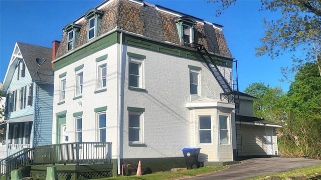 107 Garden St, Poughkeepsie, NY 12601 - view of property exterior with mansard roof