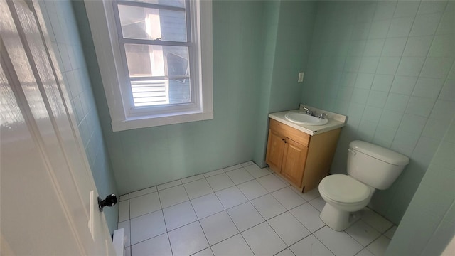 107 Garden St, Poughkeepsie, NY 12601 - half bathroom with tile patterned flooring, tile walls, toilet, and vanity