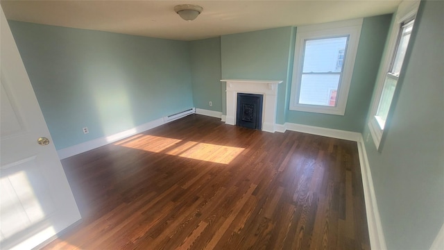 107 Garden St, Poughkeepsie, NY 12601 - unfurnished living room with baseboards, dark wood finished floors, a baseboard heating unit, and a fireplace