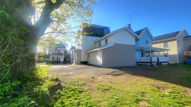 107 Garden St, Poughkeepsie, NY 12601 - rear view of house featuring a chimney