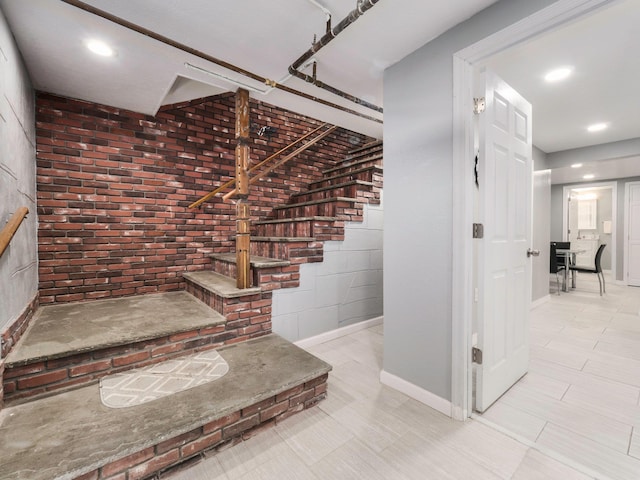 6204 Rte 52, Ellenville, NY 12428 - stairway featuring baseboards, recessed lighting, and brick wall