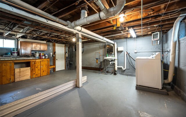 below grade area featuring washer / dryer