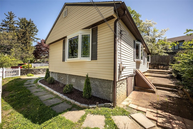 view of side of property with fence
