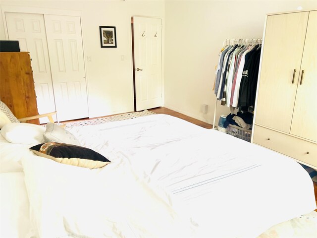 bedroom featuring a closet and baseboards