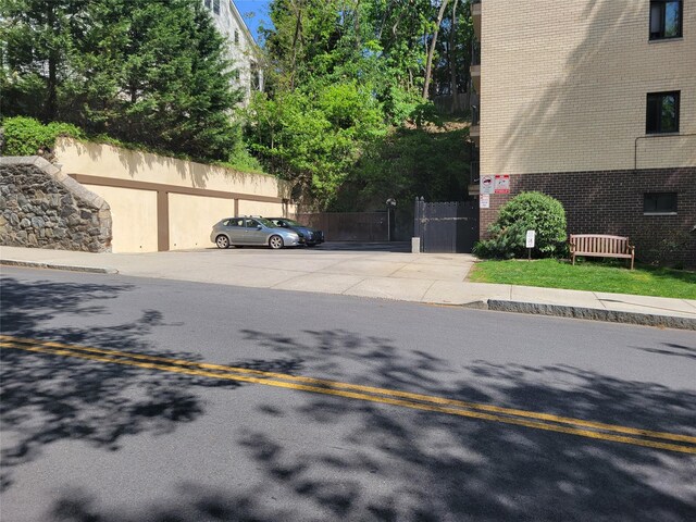 view of asphalt street with sidewalks