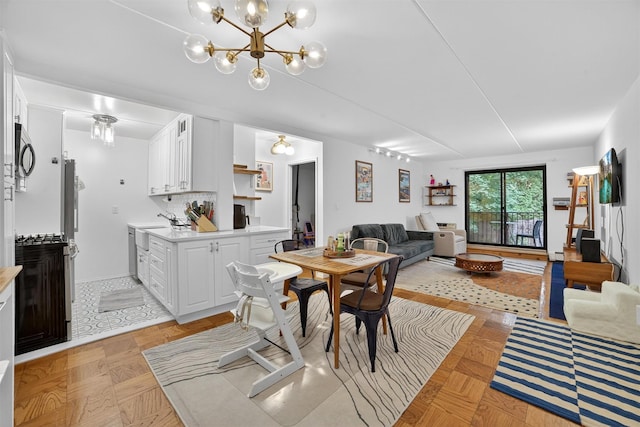 108 Sagamore Rd Unit 5F, Tuckahoe, NY 10707 - dining space featuring a chandelier