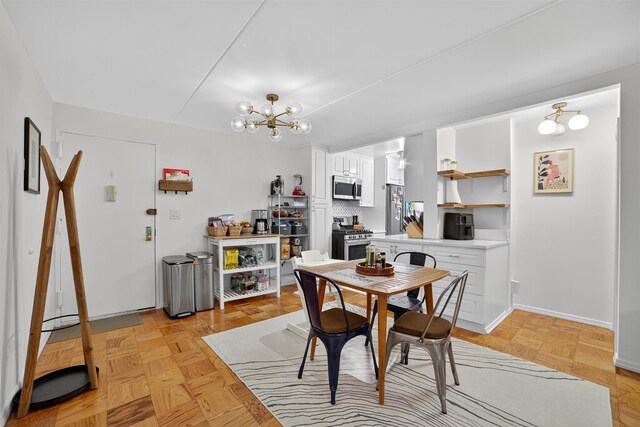 108 Sagamore Rd Unit 5F, Tuckahoe, NY 10707 - dining area featuring a chandelier