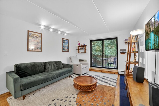 108 Sagamore Rd Unit 5F, Tuckahoe, NY 10707 - living area with wood finished floors, a baseboard heating unit, and rail lighting