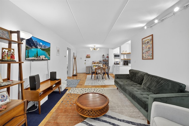 108 Sagamore Rd Unit 5F, Tuckahoe, NY 10707 - living area featuring a chandelier