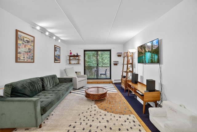 108 Sagamore Rd Unit 5F, Tuckahoe, NY 10707 - living room featuring wood finished floors, baseboard heating, and rail lighting