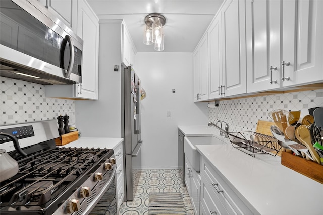 108 Sagamore Rd Unit 5F, Tuckahoe, NY 10707 - kitchen with appliances with stainless steel finishes, white cabinets, and light countertops