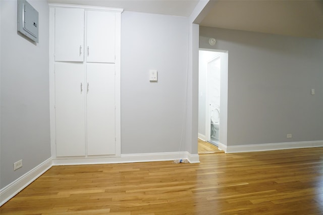 interior space with light wood finished floors and baseboards
