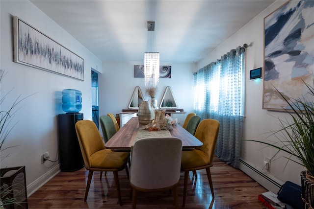 dining area with an inviting chandelier, wood finished floors, and baseboard heating