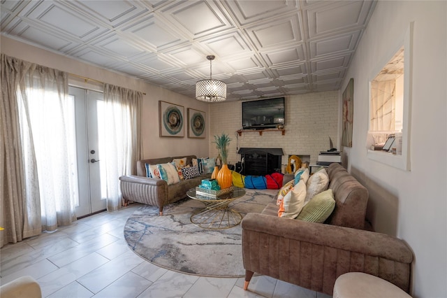 living room featuring an ornate ceiling and french doors