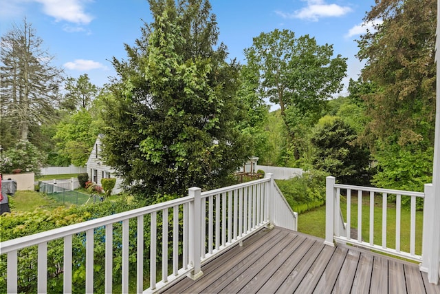 wooden terrace with a lawn