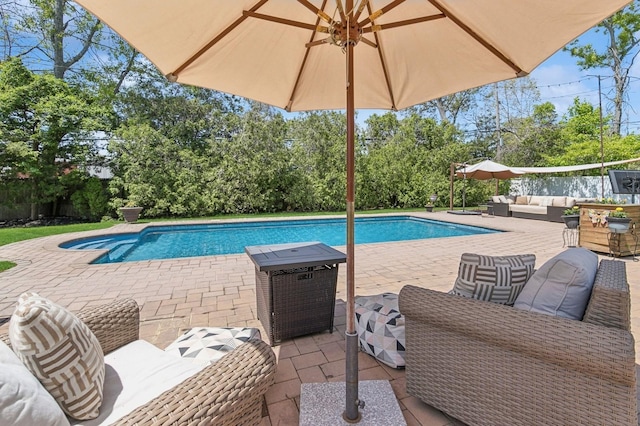 swimming pool featuring outdoor lounge area and a patio area
