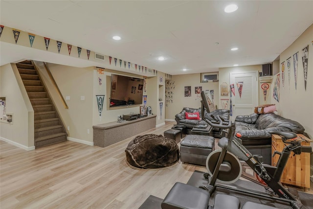 workout room featuring recessed lighting, baseboards, visible vents, and light wood-type flooring