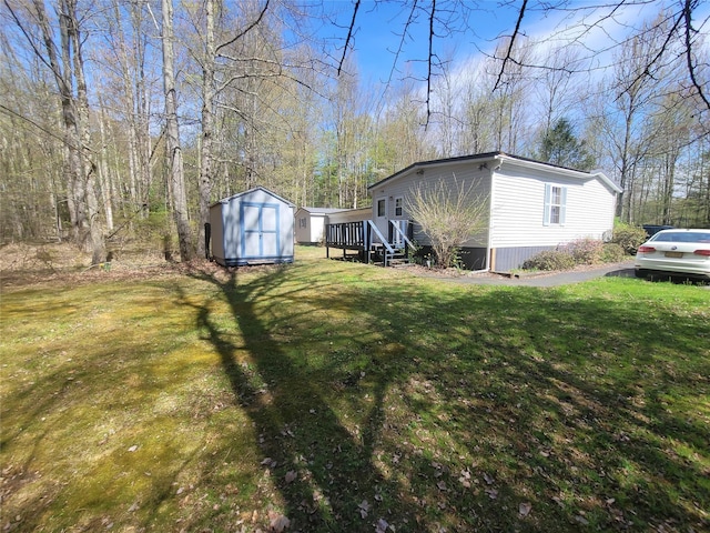view of yard with an outdoor structure and a shed