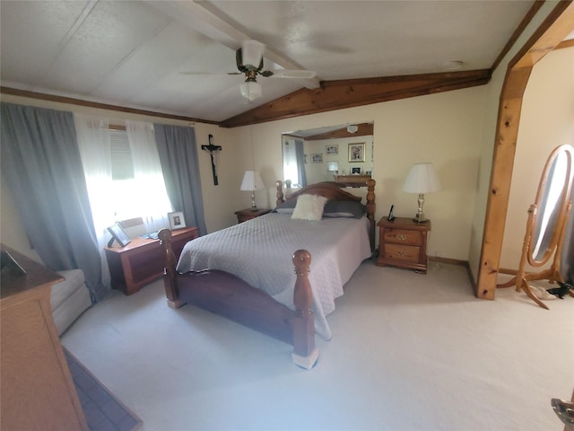 bedroom featuring vaulted ceiling with beams, light carpet, and ceiling fan