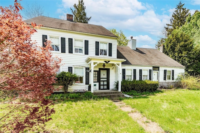 2641 Salt Point Tpke, Clinton Corners, NY 12514 - view of front facade featuring a chimney and a front yard