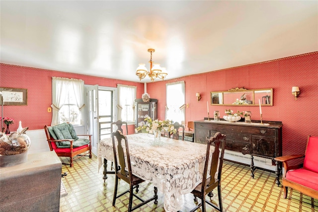 2641 Salt Point Tpke, Clinton Corners, NY 12514 - dining room with light flooring, a chandelier, wallpapered walls, and a baseboard radiator