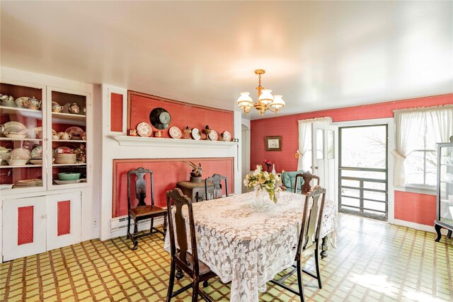 2641 Salt Point Tpke, Clinton Corners, NY 12514 - dining space with light floors, a chandelier, and a baseboard radiator