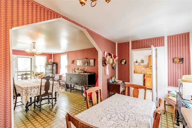 2641 Salt Point Tpke, Clinton Corners, NY 12514 - dining room with a chandelier, wallpapered walls, and tile patterned floors