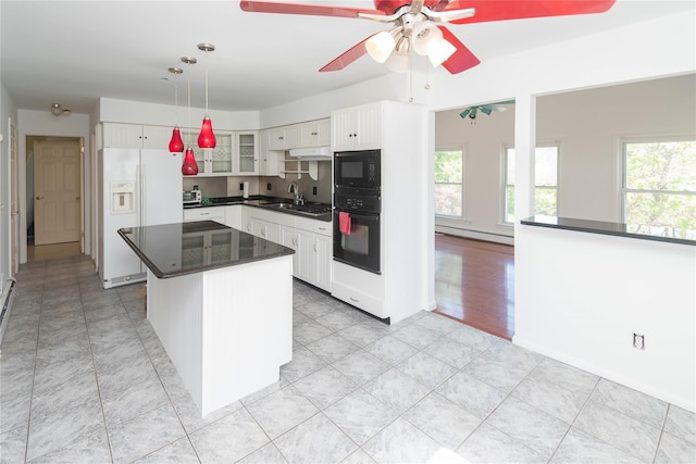 57 E Rock Cut Rd, Walden, NY 12586 - kitchen featuring black appliances, plenty of natural light, ceiling fan, and glass insert cabinets