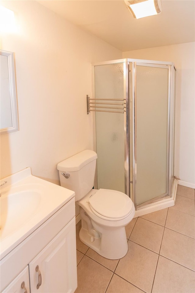 57 E Rock Cut Rd, Walden, NY 12586 - bathroom with tile patterned flooring, a stall shower, vanity, and toilet