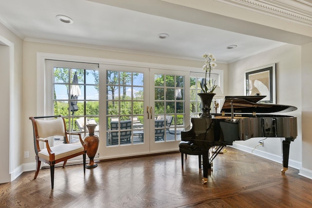 sitting room featuring french doors, ornamental molding, baseboards, and recessed lighting