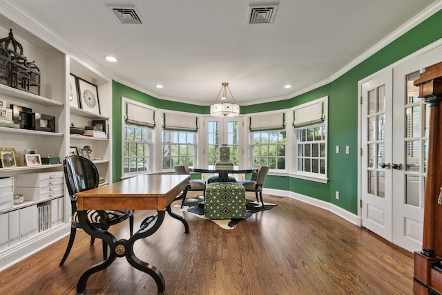 dining space featuring french doors, crown molding, healthy amount of natural light, wood finished floors, and recessed lighting