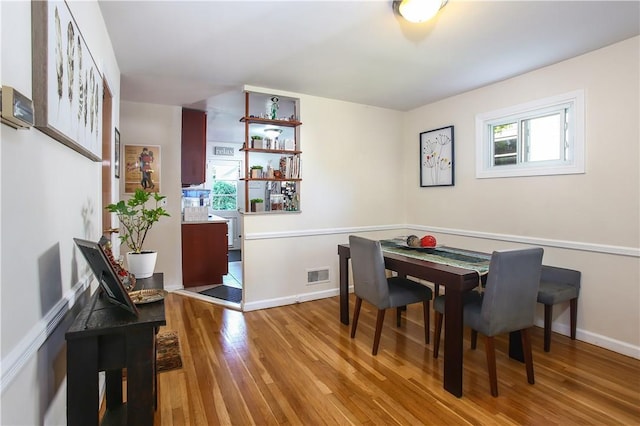 82 Sprague Rd, Scarsdale, NY 10583 - dining area featuring baseboards, wood finished floors, and visible vents