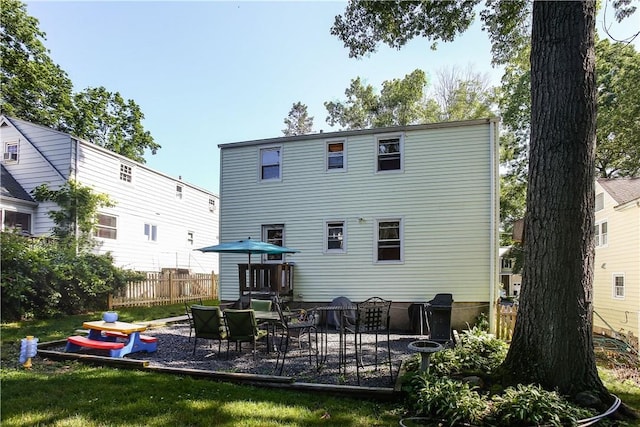 82 Sprague Rd, Scarsdale, NY 10583 - back of property with a patio and fence