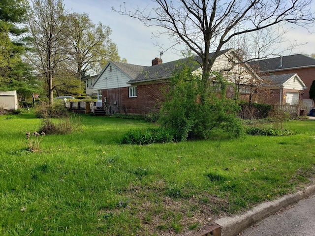 view of property exterior with a chimney and brick siding