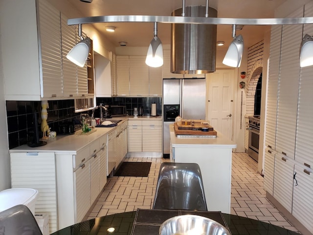 214-40 24th Ave, Bayside, NY 11360 - kitchen featuring a sink, appliances with stainless steel finishes, a center island, tasteful backsplash, and light countertops