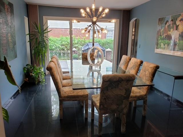 214-40 24th Ave, Bayside, NY 11360 - dining room featuring a chandelier