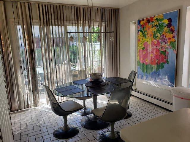 214-40 24th Ave, Bayside, NY 11360 - dining area featuring baseboard heating and brick patterned floors