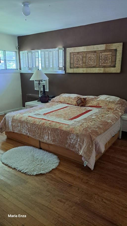 214-40 24th Ave, Bayside, NY 11360 - bedroom with wood finished floors and baseboards