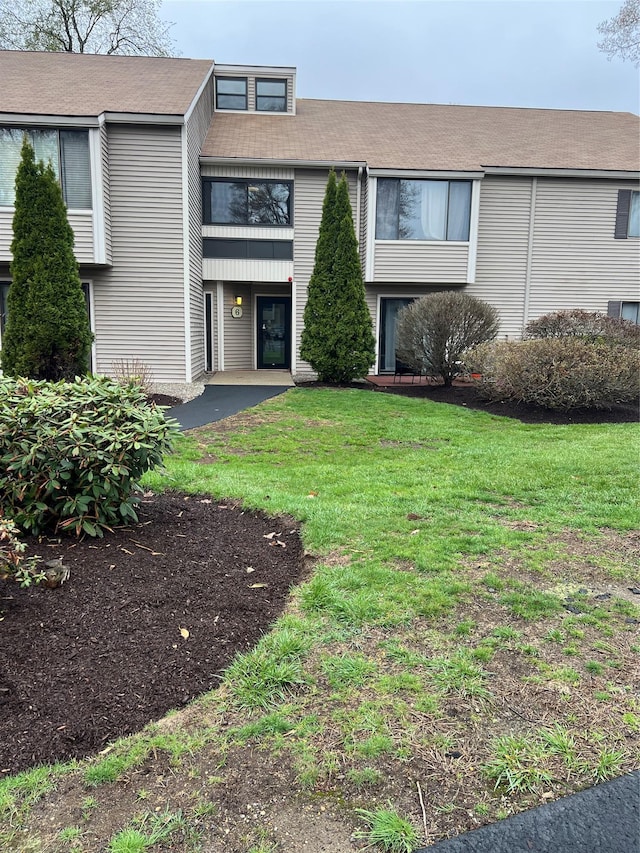 view of front of home with a front yard