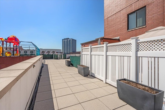 view of patio / terrace featuring fence