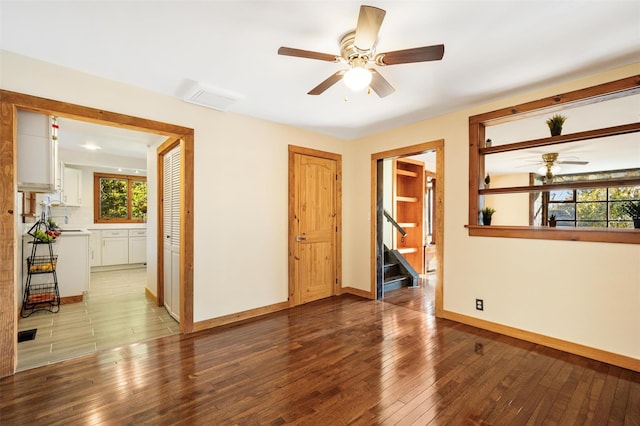 53 Jameson Hill Rd, Clinton Corners, NY 12514 - spare room featuring a ceiling fan, stairway, baseboards, and wood-type flooring