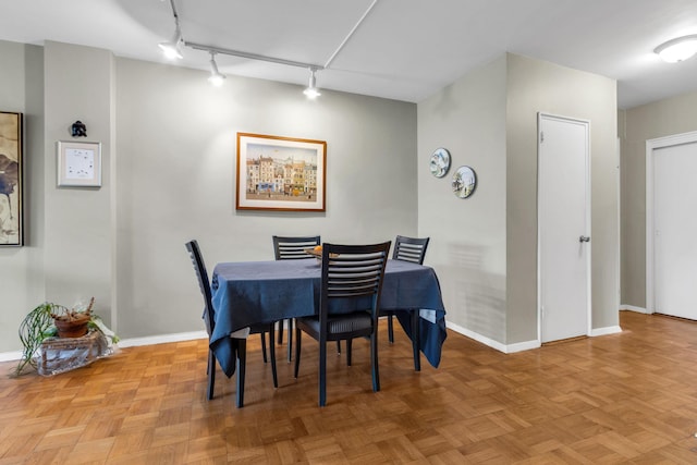 2601 Henry Hudson Pkwy Unit 5E, Bronx, NY 10463 - dining room with rail lighting and baseboards