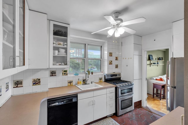 2601 Henry Hudson Pkwy Unit 5E, Bronx, NY 10463 - kitchen with dishwasher, freestanding refrigerator, double oven range, tasteful backsplash, and white cabinets