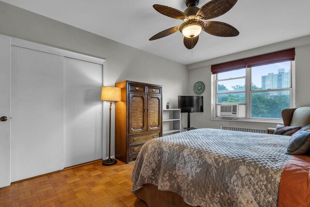 2601 Henry Hudson Pkwy Unit 5E, Bronx, NY 10463 - bedroom with a ceiling fan, radiator heating unit, and cooling unit