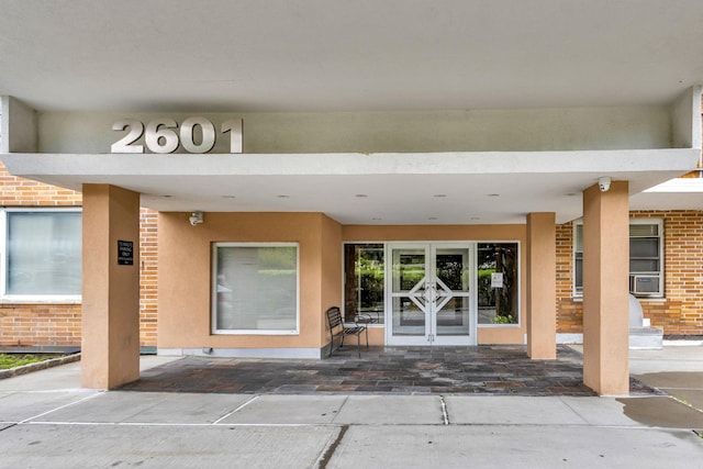 2601 Henry Hudson Pkwy Unit 5E, Bronx, NY 10463 - entrance to property with french doors, brick siding, and cooling unit